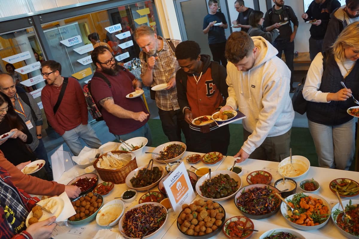 Attendees queuing for the lunch buffet.